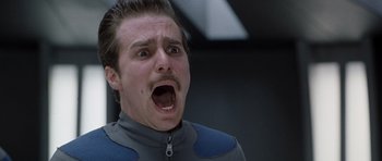 Movie still from “Galaxy Quest” (1999), directed by Dean Parisot – A man with a beard and mustache is looking surprised; Close Up shot, Low angle