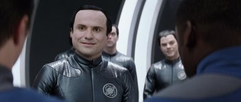Movie still from “Galaxy Quest” (1999), directed by Dean Parisot – A group of men in black and white suits; Close Up shot, Over the shoulder angle