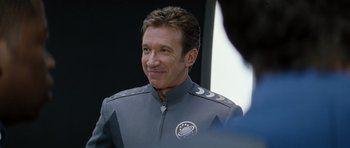 Movie still from “Galaxy Quest” (1999), directed by Dean Parisot – A person wearing a uniform; Close Up shot, Over the shoulder angle