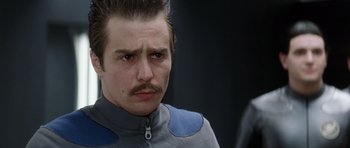 Movie still from “Galaxy Quest” (1999), directed by Dean Parisot – A person with a mustache; Close Up shot, Over the shoulder angle