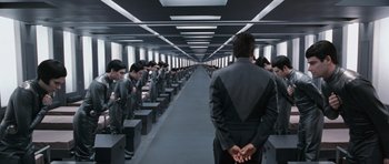 Movie still from “Galaxy Quest” (1999), directed by Dean Parisot – A group of people sitting in a room with their backs to the camera; Wide shot, High angle