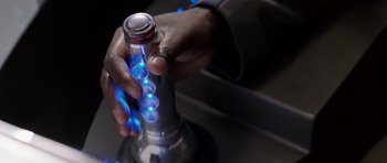 Movie still from “Galaxy Quest” (1999), directed by Dean Parisot – A person holding a blue light in their hand; Extreme Close Up shot, High angle