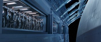 Movie still from “Galaxy Quest” (1999), directed by Dean Parisot – A group of people standing in a room; Extreme Wide shot, High angle