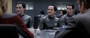 Movie still from “Galaxy Quest” (1999), directed by Dean Parisot – A group of people sitting at a table; Medium shot, Over the shoulder angle