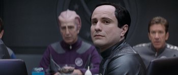 Movie still from “Galaxy Quest” (1999), directed by Dean Parisot – Two people in a room with a bowl of food; Close Up shot, Over the shoulder angle