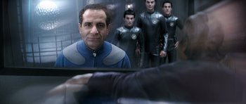 Movie still from “Galaxy Quest” (1999), directed by Dean Parisot – A group of men standing next to each other in a room; Medium shot, Over the shoulder angle