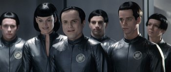 Movie still from “Galaxy Quest” (1999), directed by Dean Parisot – A group of men in black and white suits; Close Up shot, Over the shoulder angle