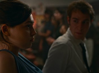 A man and a woman are looking at each other