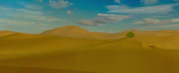 Movie still from “Hell or High Water” (2016), directed by David Mackenzie – A desert landscape with sand dunes and a sky background; Extreme Wide shot, Low angle
