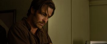 Movie still from “Hell or High Water” (2016), directed by David Mackenzie – A person with long hair; Close Up shot, Over the shoulder angle