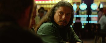 Movie still from “Hell or High Water” (2016), directed by David Mackenzie – A man with long hair and a long beard; Close Up shot, Over the shoulder angle