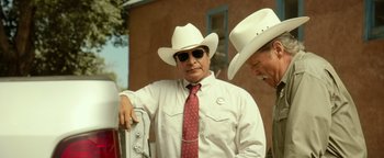 Movie still from “Hell or High Water” (2016), directed by David Mackenzie – A man in a white shirt and a red neck tie; Medium shot, Over the shoulder angle
