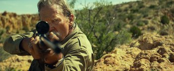 Movie still from “Hell or High Water” (2016), directed by David Mackenzie – A man is holding a gun in his hand; Close Up shot, Over the shoulder angle
