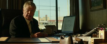 Movie still from “Hell or High Water” (2016), directed by David Mackenzie – An older woman sitting in front of a computer; Medium shot, Over the shoulder angle