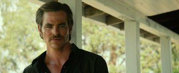 Movie still from “Hell or High Water” (2016), directed by David Mackenzie – A person wearing a black shirt; Close Up shot, Over the shoulder angle
