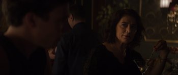 Movie still from “Hellraiser” (2022), directed by David Bruckner – A woman standing next to a man in a dark room; Close Up shot, Over the shoulder angle