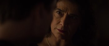 Movie still from “Hellraiser” (2022), directed by David Bruckner – A person looking at the camera; Close Up shot, Over the shoulder angle