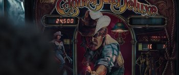 Movie still from “Hellraiser” (2022), directed by David Bruckner – An image of a man with a cowboy hat on; Medium shot, High angle