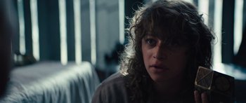 Movie still from “Hellraiser” (2022), directed by David Bruckner – A person sitting in a room; Close Up shot, Over the shoulder angle