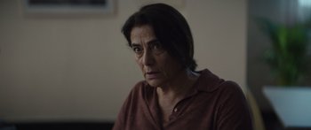 Movie still from “Hellraiser” (2022), directed by David Bruckner – An older woman is looking at the camera; Close Up shot, Over the shoulder angle