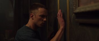 Movie still from “Hellraiser” (2022), directed by David Bruckner – A man leaning against a wall with his hand on the wall; Close Up shot, Low angle