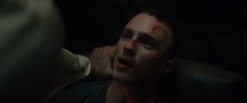 Movie still from “Hellraiser” (2022), directed by David Bruckner – A man with blood all over his face and neck; Close Up shot, Low angle