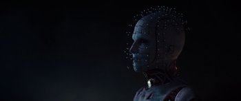 Movie still from “Hellraiser” (2022), directed by David Bruckner – A man with a face made out of pins; Close Up shot, Low angle