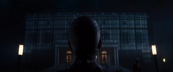 Movie still from “Hellraiser” (2022), directed by David Bruckner – A man with a spiky head in front of a building at night; Close Up shot, Low angle