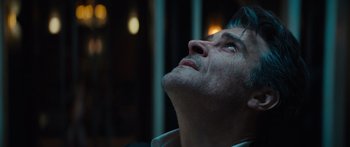 Movie still from “Hellraiser” (2022), directed by David Bruckner – A person looking up at the sky; Close Up shot, Low angle