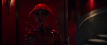 Movie still from “Hellraiser” (2022), directed by David Bruckner – A woman in a red outfit and a red hat; Close Up shot, Low angle