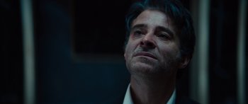 Movie still from “Hellraiser” (2022), directed by David Bruckner – A person with blue hair; Close Up shot, Low angle