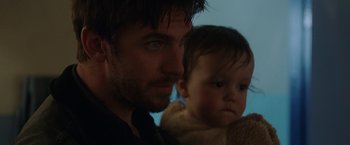 Movie still from “Her Smell” (2018), directed by Alex Ross Perry – A person and a baby; Close Up shot, Over the shoulder angle