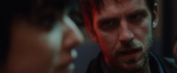 Movie still from “Her Smell” (2018), directed by Alex Ross Perry – A man's face with blood on his face; Extreme Close Up shot, Over the shoulder angle