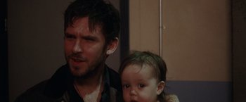 Movie still from “Her Smell” (2018), directed by Alex Ross Perry – A man and a child are standing next to each other; Close Up shot, Over the shoulder angle