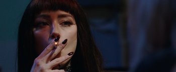 Movie still from “Her Smell” (2018), directed by Alex Ross Perry – A person smoking a cigarette; Close Up shot, Low angle