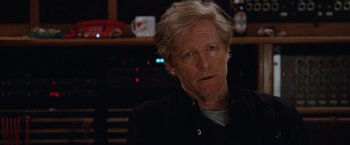 Movie still from “Her Smell” (2018), directed by Alex Ross Perry – A person wearing a black jacket; Close Up shot, Over the shoulder angle