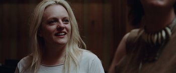 Movie still from “Her Smell” (2018), directed by Alex Ross Perry – A person with blonde hair smiling; Close Up shot, Over the shoulder angle