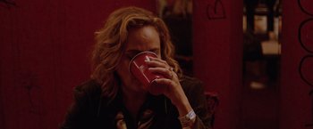 Movie still from “Her Smell” (2018), directed by Alex Ross Perry – A woman drinking from a red plastic cup; Close Up shot, High angle