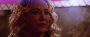 Movie still from “Her Smell” (2018), directed by Alex Ross Perry – A woman with blonde hair looking to her left; Close Up shot, Over the shoulder angle