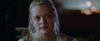 Movie still from “Her Smell” (2018), directed by Alex Ross Perry – A person wearing a white shirt; Close Up shot, Over the shoulder angle