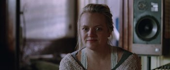 Movie still from “Her Smell” (2018), directed by Alex Ross Perry – A person wearing a sweater; Close Up shot, Over the shoulder angle