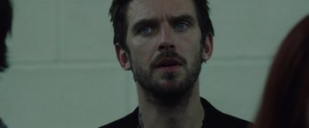 Movie still from “Her Smell” (2018), directed by Alex Ross Perry – A person wearing a black shirt; Close Up shot, Low angle