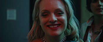 Movie still from “Her Smell” (2018), directed by Alex Ross Perry – A person smiling for the camera; Close Up shot, High angle