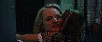 Movie still from “Her Smell” (2018), directed by Alex Ross Perry – A person holding a stuffed animal; Close Up shot, Over the shoulder angle