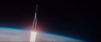 Movie still from “Hidden Figures” (2016), directed by Theodore Melfi – A rocket is flying through the air over the earth; Extreme Wide shot, Low angle