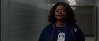 Movie still from “Hidden Figures” (2016), directed by Theodore Melfi – A woman standing in front of a brick wall; Close Up shot, Over the shoulder angle