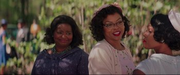 Movie still from “Hidden Figures” (2016), directed by Theodore Melfi – Two women standing next to each other in front of trees; Close Up shot, Over the shoulder angle