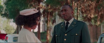 Movie still from “Hidden Figures” (2016), directed by Theodore Melfi – A man and a woman standing next to each other outside; Medium shot, Over the shoulder angle