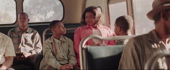 Movie still from “Hidden Figures” (2016), directed by Theodore Melfi – A woman and two young boys sitting on a bus; Medium shot, Over the shoulder angle