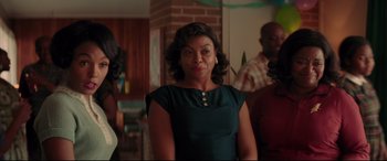 Movie still from “Hidden Figures” (2016), directed by Theodore Melfi – A woman in a green dress; Medium shot, Over the shoulder angle
